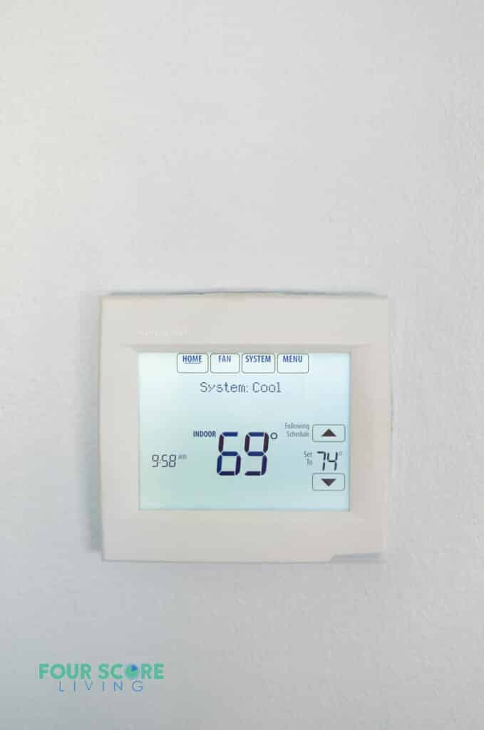 a thermometer on the wall showing the inside temperature