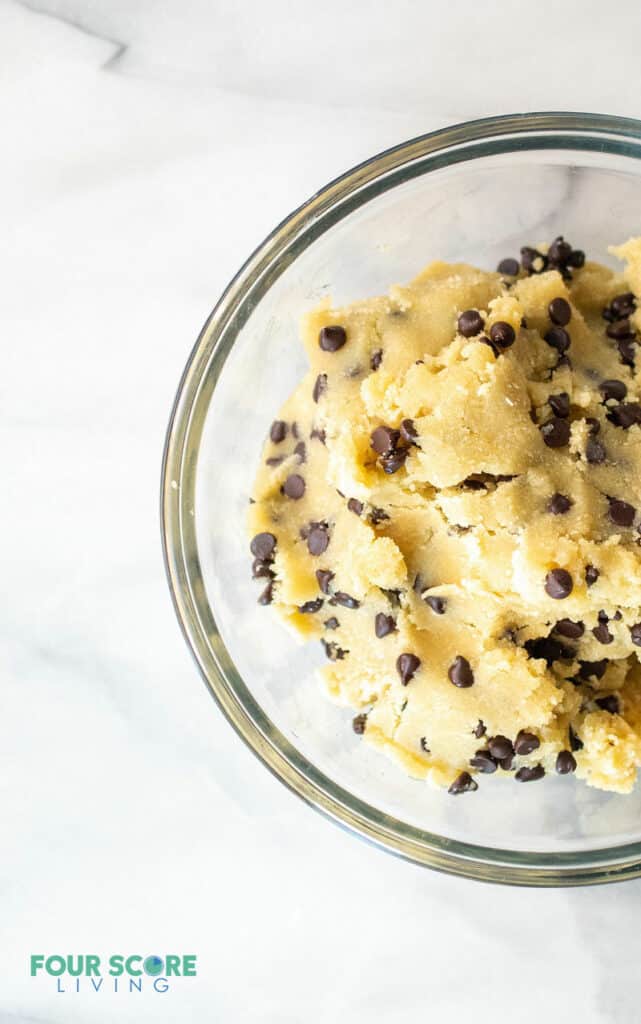 top down view of keto cookie dough in a clear bowl
