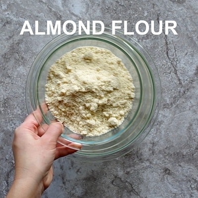 Top view photo of almond flour in a glass bowl.