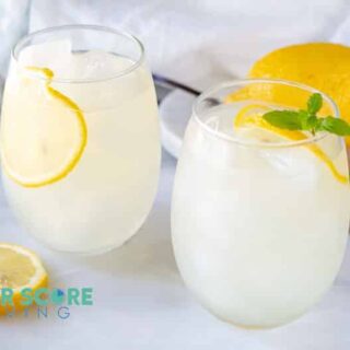 two glasses of keto lemonade with lemon and mint