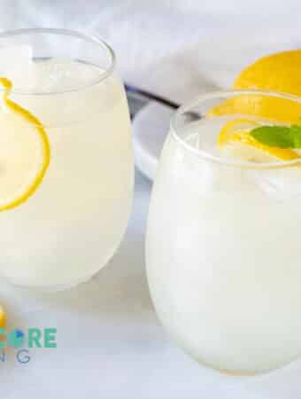 two glasses of keto lemonade with lemon and mint