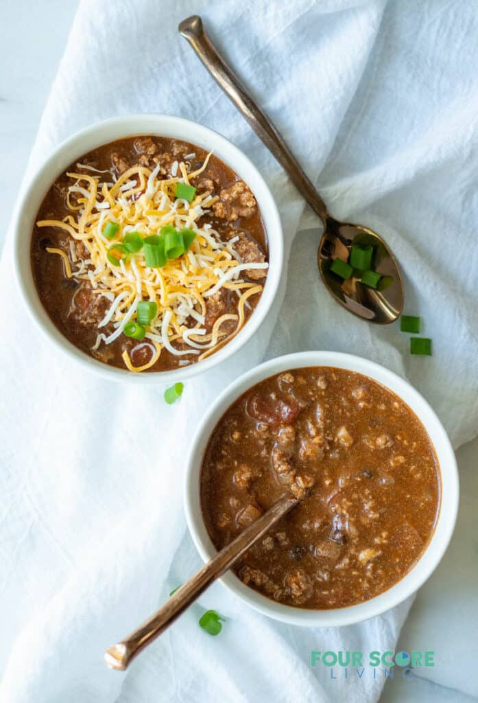 keto chili in a white bowl with cheese