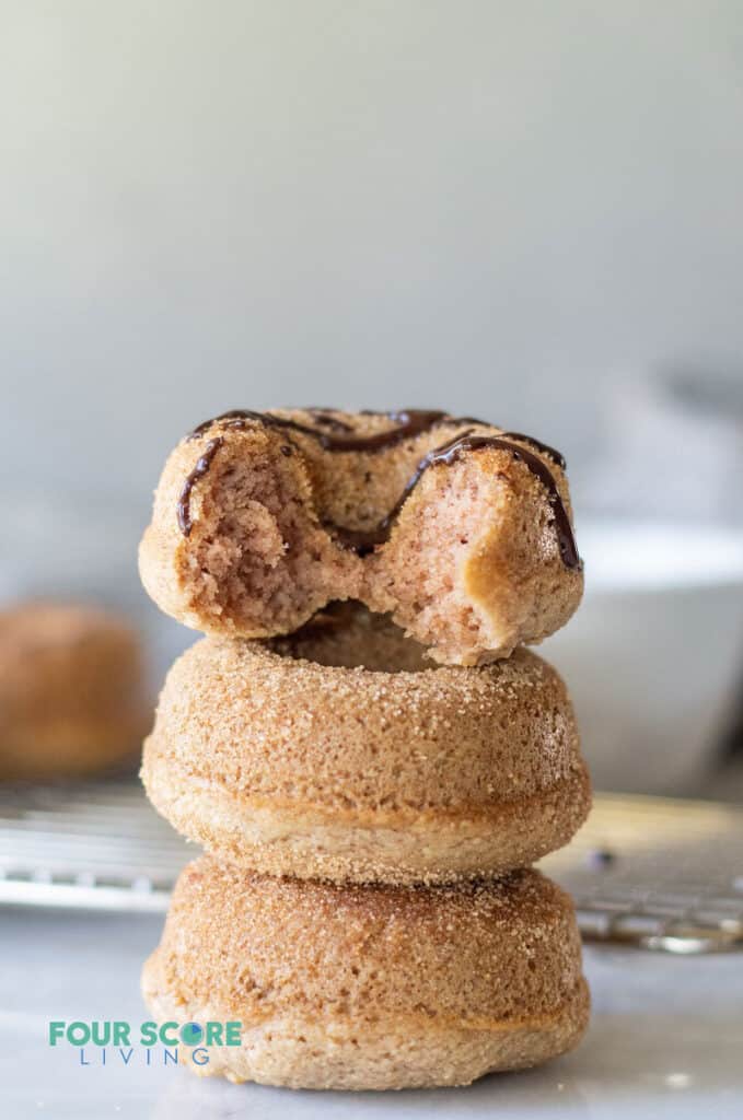 three keto cinnamon sugar donuts stacked