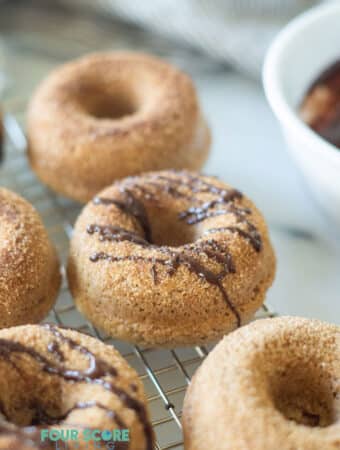 keto cinnamon sugar donuts with a chocolate drizzle