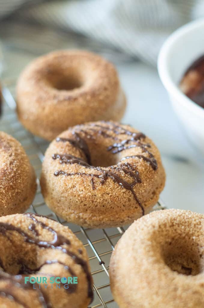 keto cinnamon sugar donuts with a chocolate drizzle