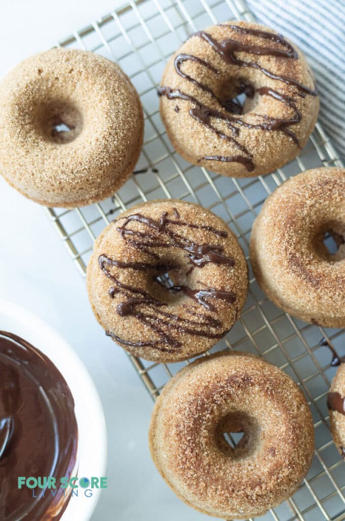 keto cinnamon sugar donuts with a chocolate drizzle