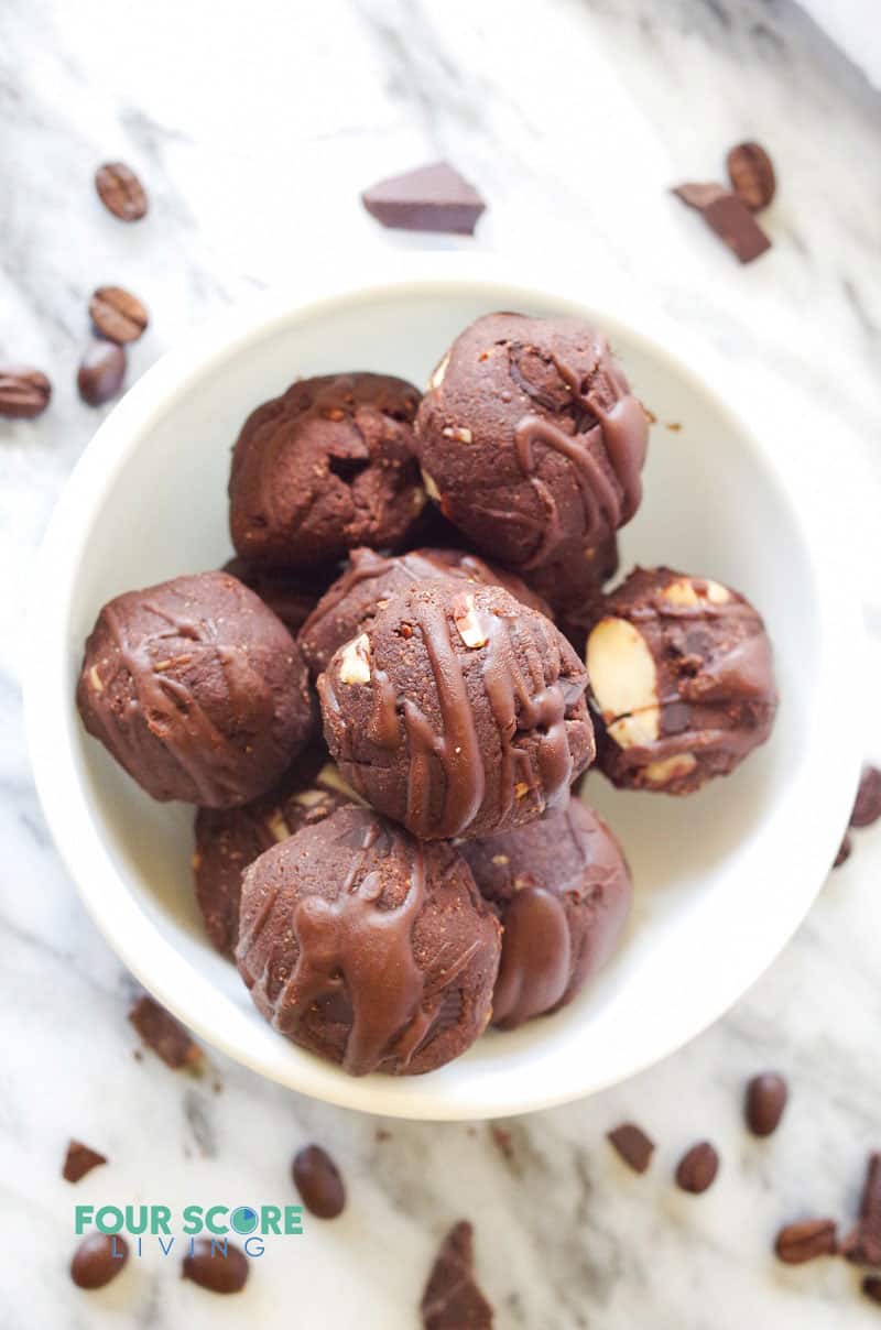 a white bowl filled with chocolate energy bites