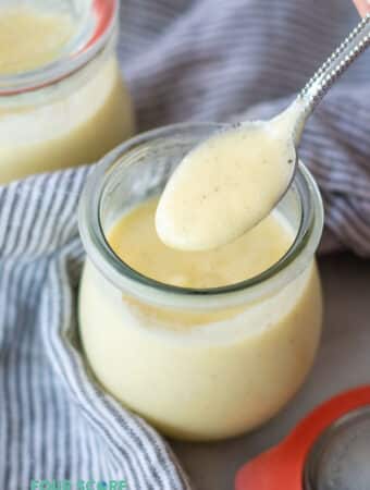 a spoonful of keto pudding over a jar of keto pudding