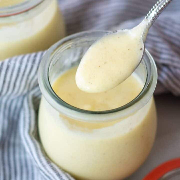 a spoonful of keto pudding over a jar of keto pudding