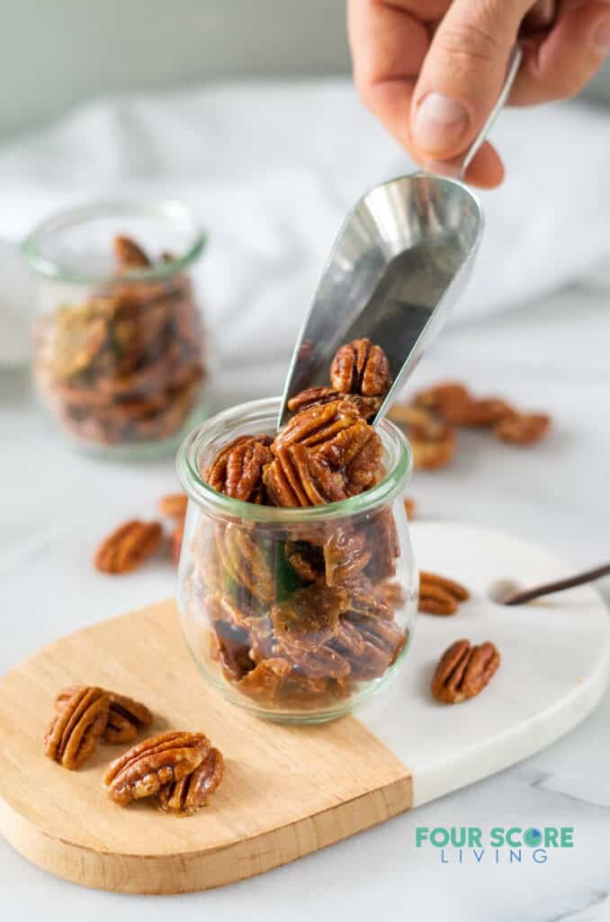 a scoop of keto candied pecans