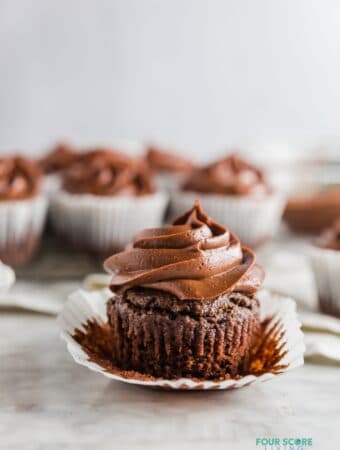 a keto chocolate cupcake with the wrapper peeled back