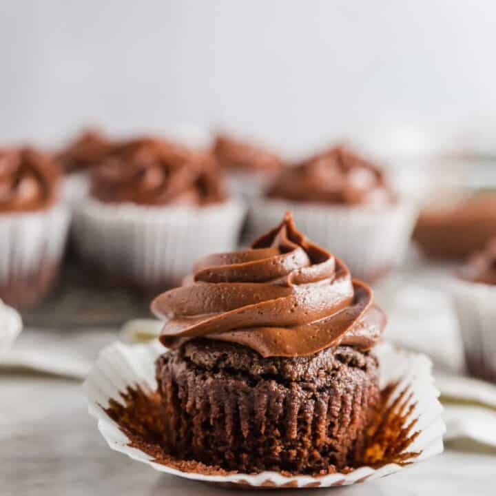 a keto chocolate cupcake with the wrapper peeled back
