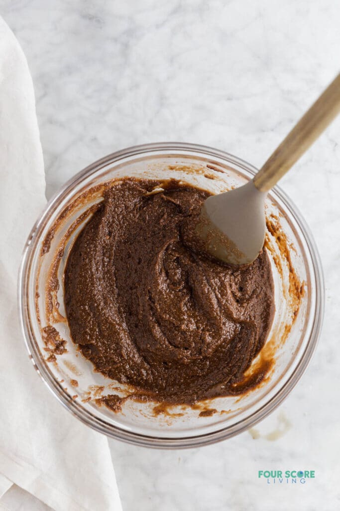 a bowl filled with almond flour chocolate cupcake batter