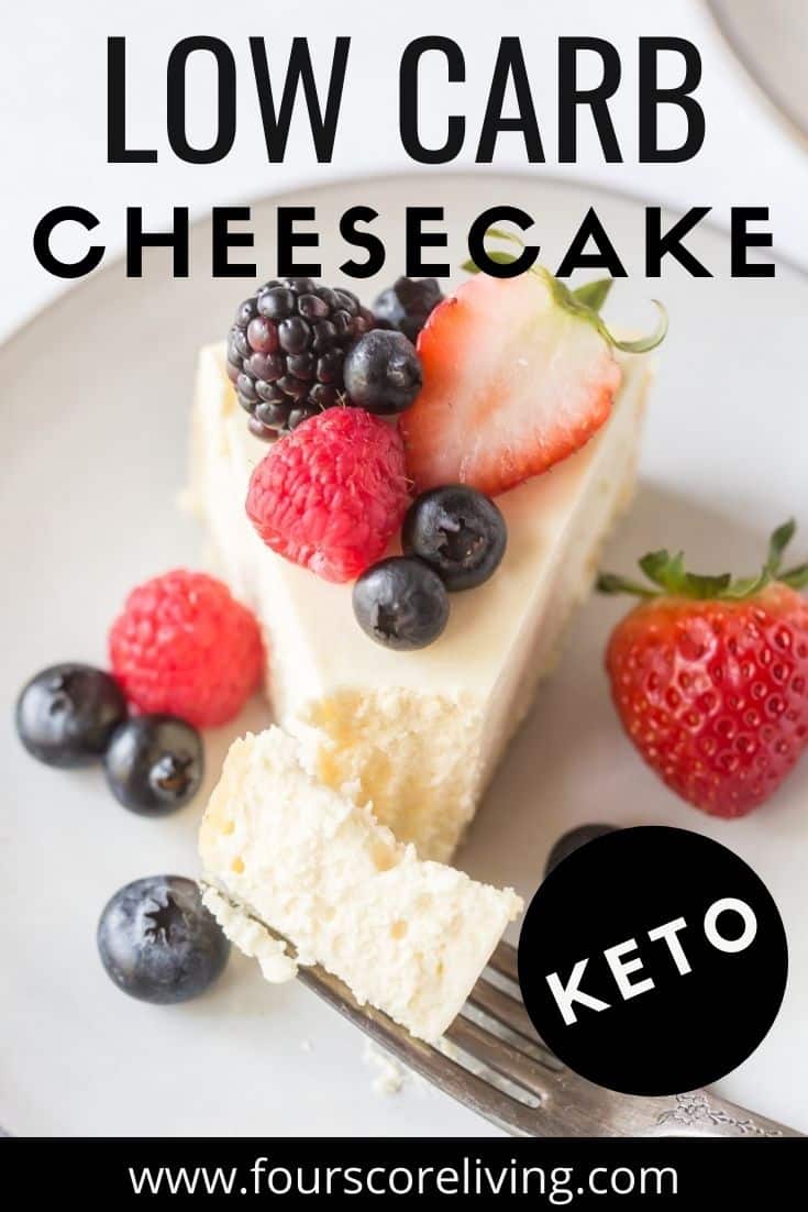 A slice of cheesecake topped with fresh berries on a plate. image includes a title, Low carb cheesecake, Keto.