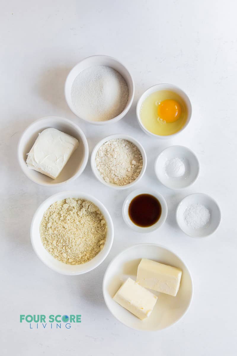 top down view of ingredients for cream cheese cookies in small bowls.