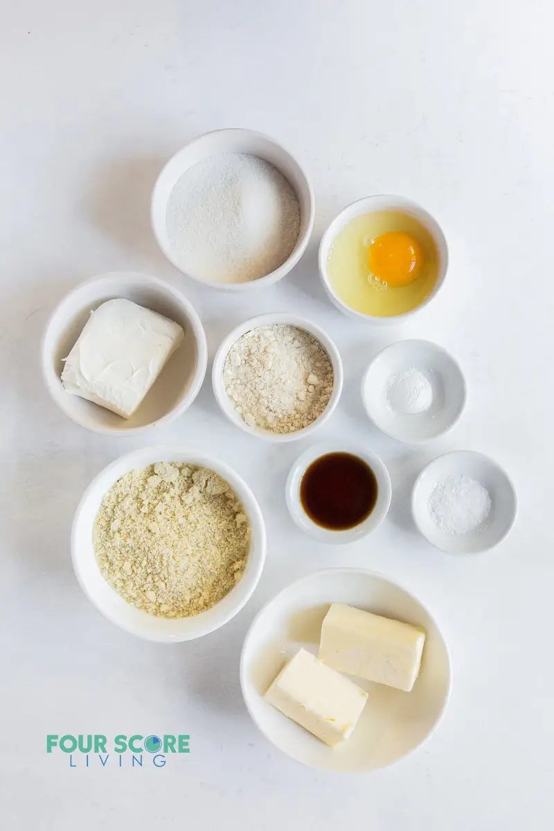 top down view of ingredients for cream cheese cookies in small bowls.