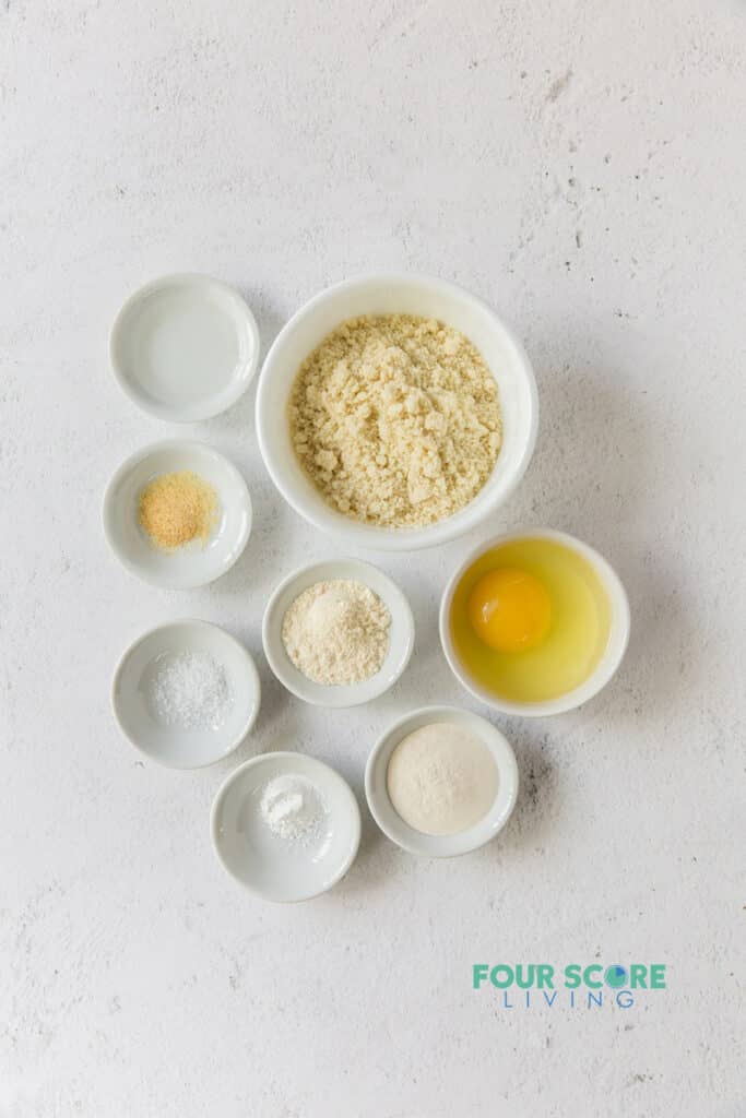 ingredients for keto tortillas in separate white bowls.