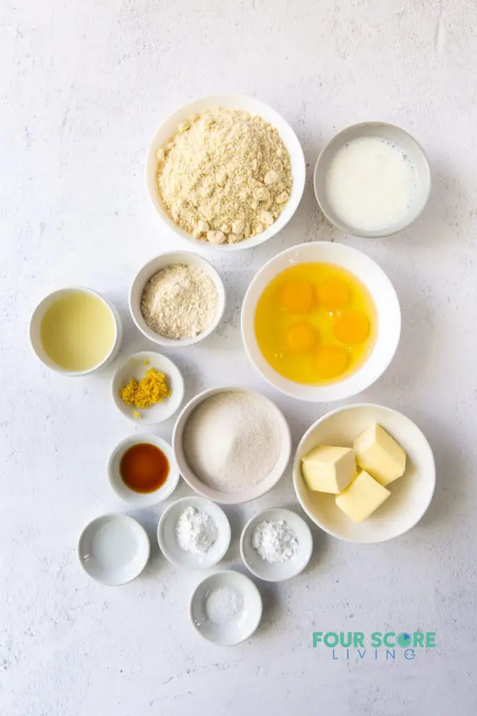 top down view of ingredients for keto lemon cake, including butter, eggs, flours, lemon zest, and others.