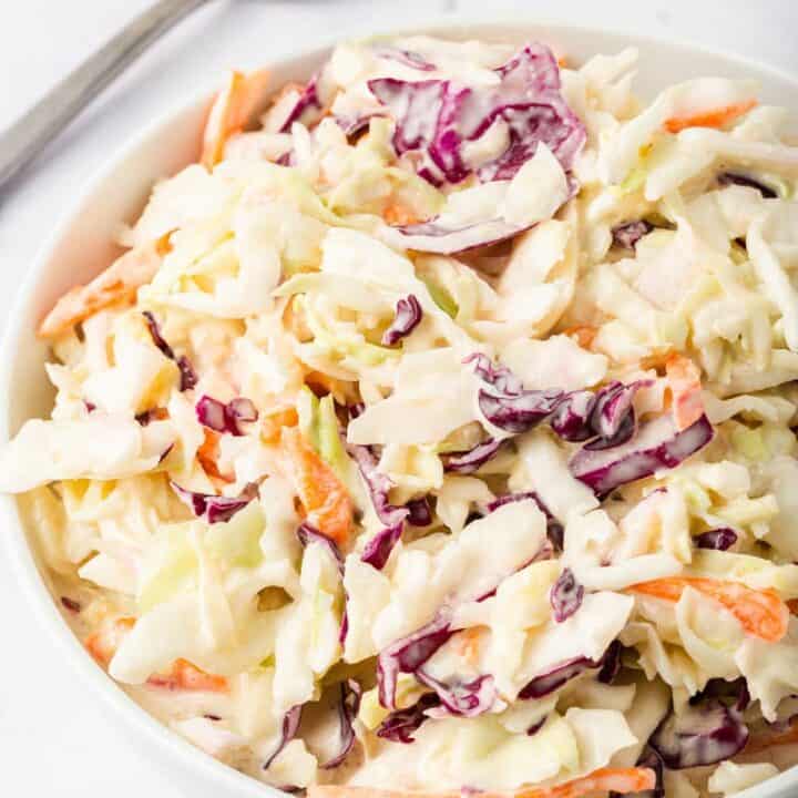 close up of keto coleslaw in a white bowl