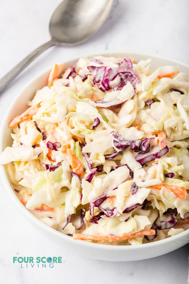 close up of keto coleslaw in a white bowl