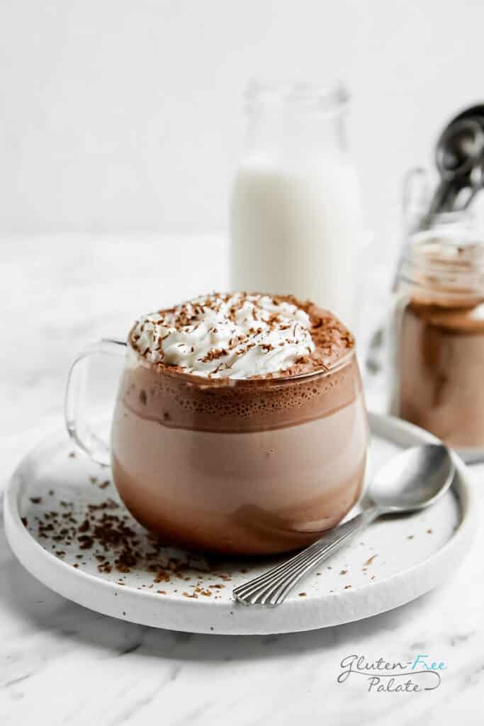 hot cocoa in a mug with whipped cream on top