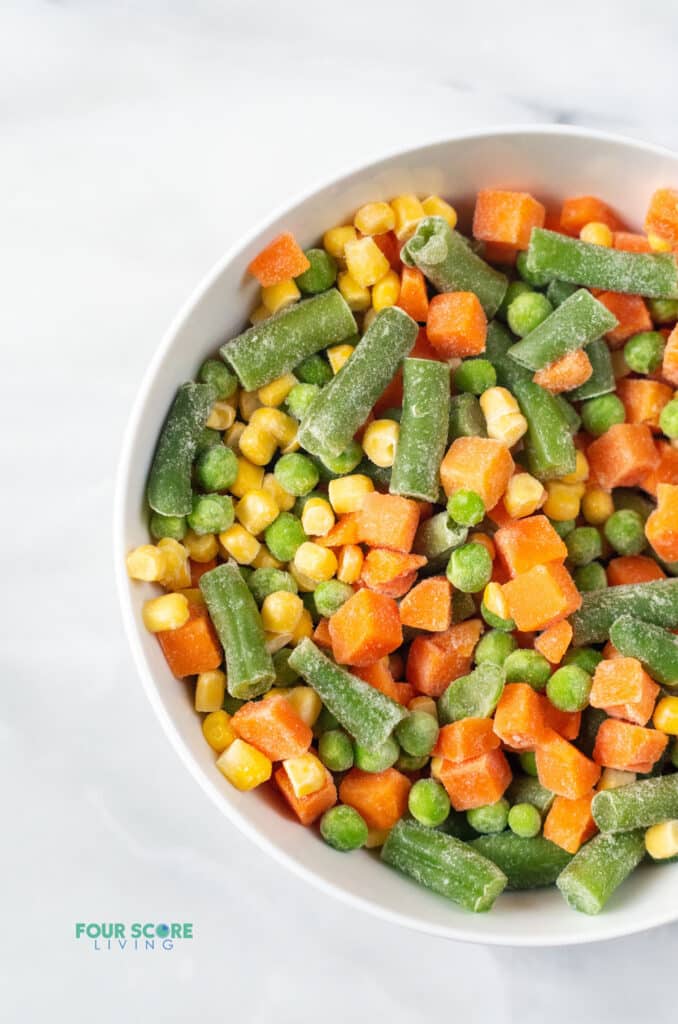 frozen mixed vegetables in a white bowl