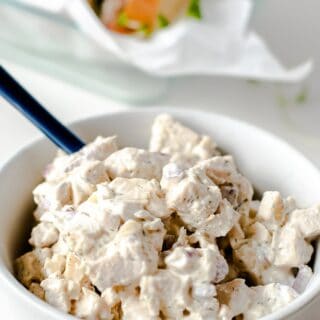 keto chicken salad in a white bowl with a spoon