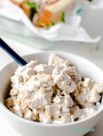 keto chicken salad in a white bowl with a spoon