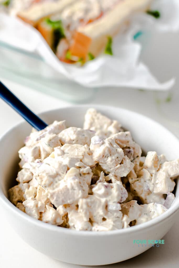 keto chicken salad in a white bowl with a spoon