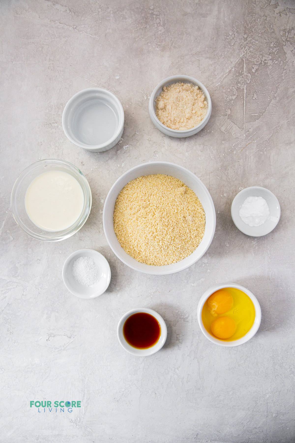 The ingredients for keto waffles measured into small bowls on a countertop