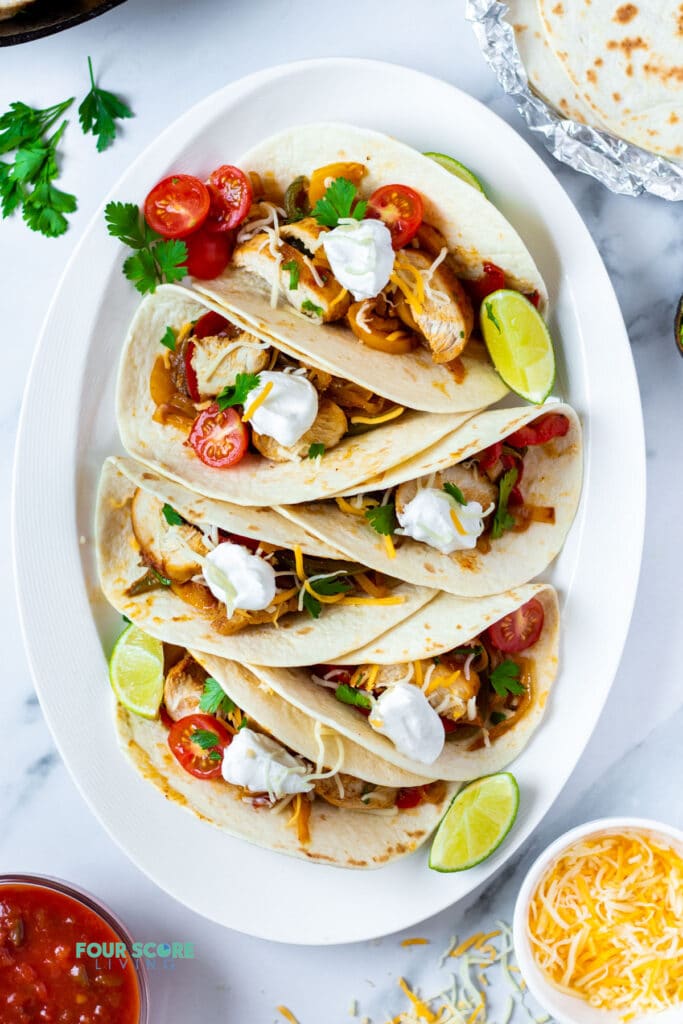 top down view of keto chicken fajitas on a plate with garnish