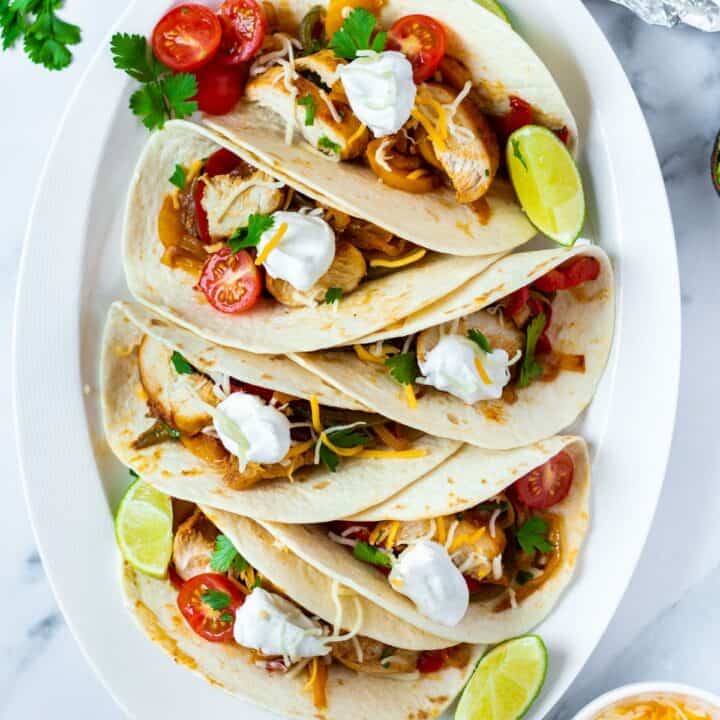 top down view of keto chicken fajitas on a plate with garnish