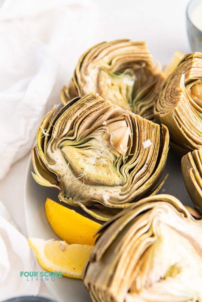 closeup view of cooked artichokes sliced in half
