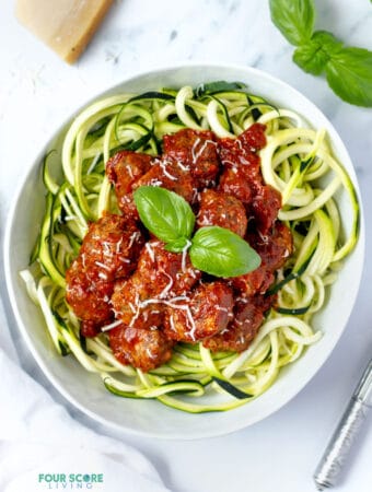 top down view keto meatballs over zoodles