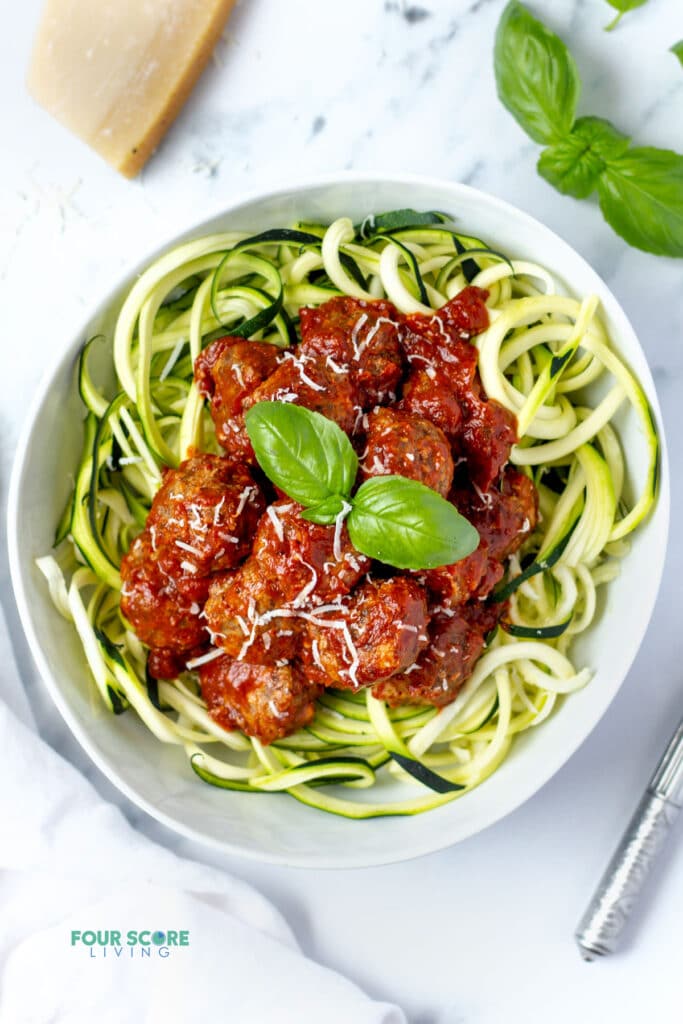 top down view keto meatballs over zoodles