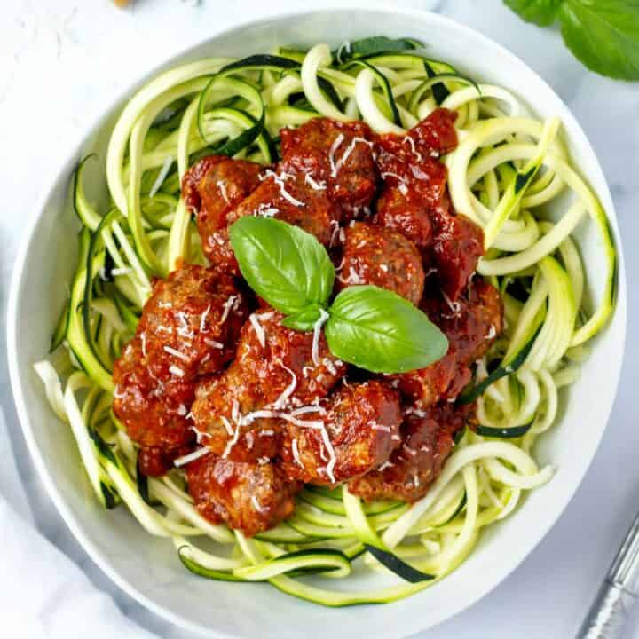 top down view keto meatballs over zoodles