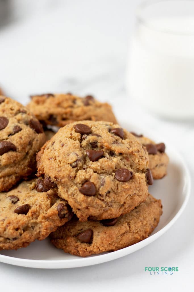 close up of keto chocolate chip cookies on a white plate