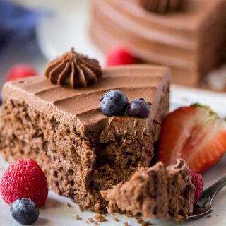 close up of a slice of almond flour chocolate cake with a bite out