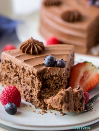 close up of a slice of almond flour chocolate cake with a bite out