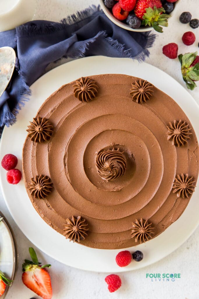 top down view of a whole almond flour cake with chocolate frosting