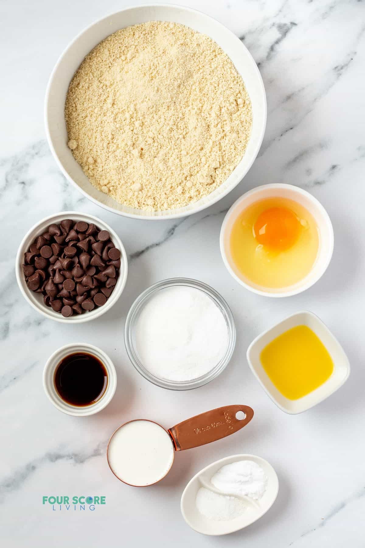 The ingredients for almond flour scones including egg, and chocolate chips