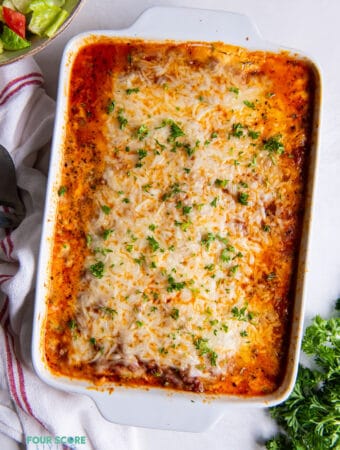 a white casserole dish of lasagna, viewed from above