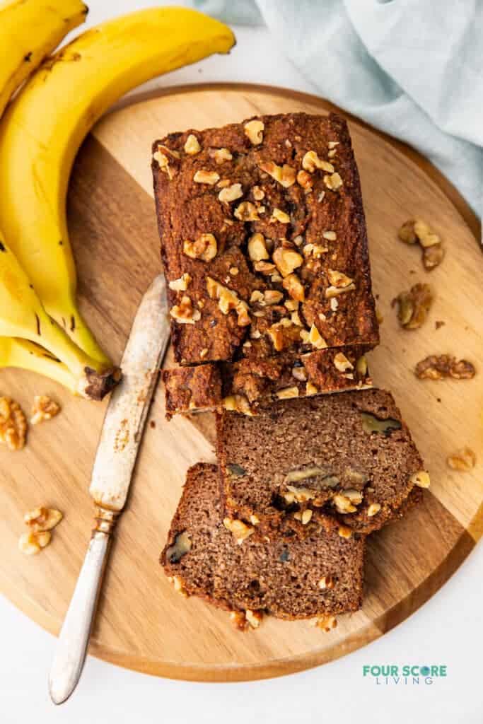 top down view of almond flour banana bread loaf with three slices cut out