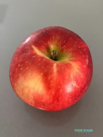 a cosmic crisp apple on a counter top