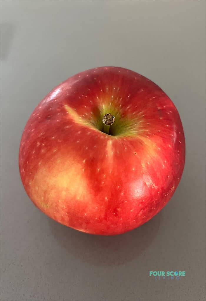 a cosmic crisp apple on a counter top