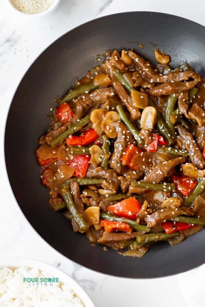 black pepper angus steak ingredients in a wok