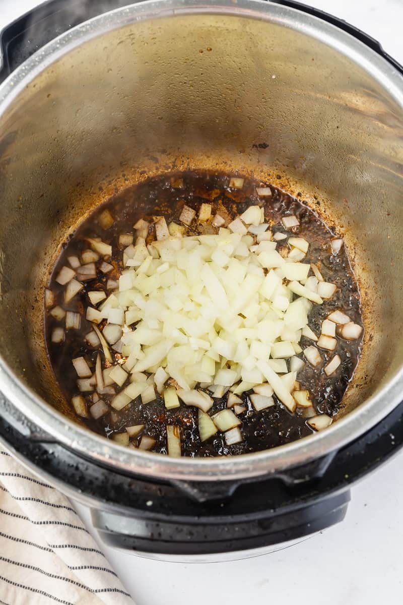 onions and seasonings in an instant pot