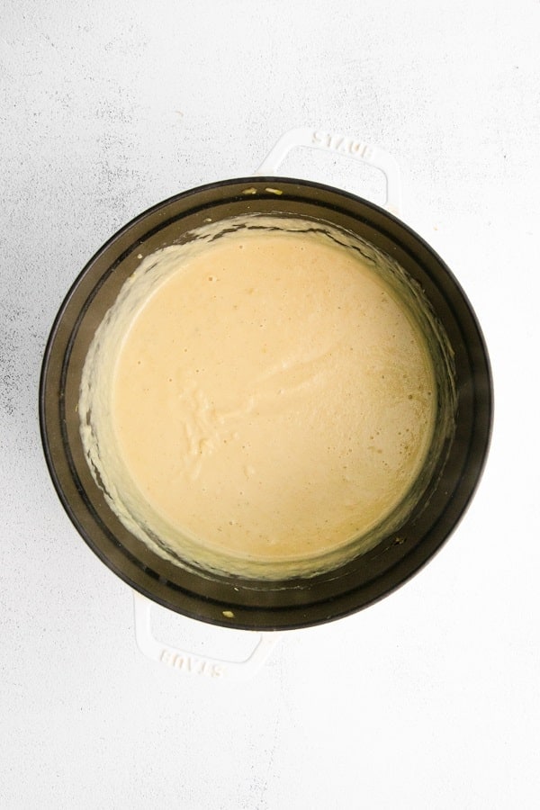 Top view photo of a large stockpot with the ingredients to make Magic Leek Soup blended together until creamy.