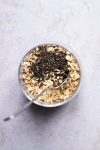 top view photo of a glass container with oats and chia seeds inside