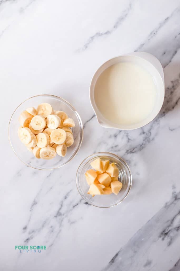 Top view photo of the ingredients to make Banana Juice, in separate bowls.